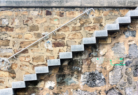 stair with stone steps and a railing outdoorsの写真素材