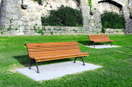 wooden benches on a gardenの写真素材