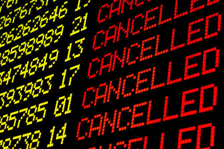 Cancelled flights on airport board panel