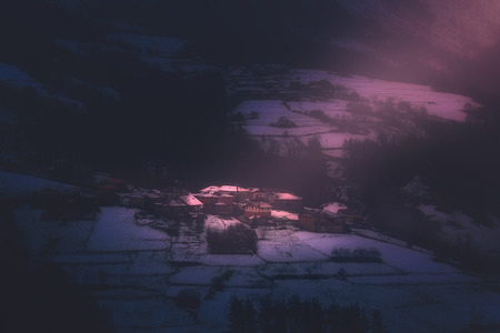 christmas landscape with zaloa village at snowy winter の写真素材
