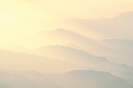pattern of distant misty mountains at sunsetの写真素材