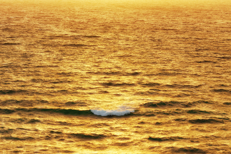 wave on the sea at the sunsetの写真素材
