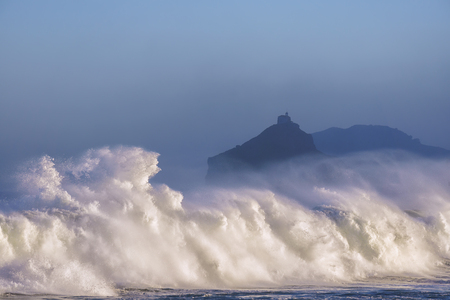 wave breaking in Bakio near gaztelugatxeの写真素材
