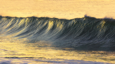 beautiful wave at the sunsetの写真素材
