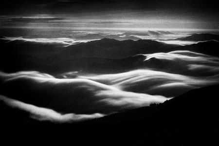 Dark landcape of Mountain valley with fog. Noise added
