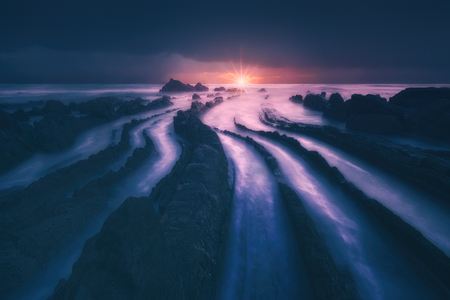 flysch rocks in barrika beach at the sunsetの写真素材