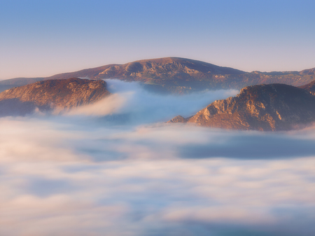 Urkiola and Gorbea mountains with fog at morningの写真素材