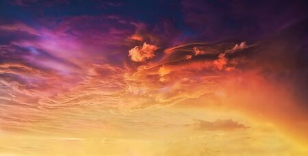 background of amazing cloudscape with dramatic sunset clouds in skyの写真素材