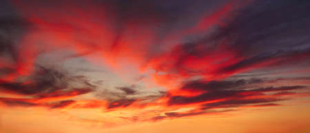 background of cloudscape with red clouds at sunset on skyの写真素材