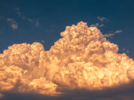 cumulonimbus stormy clouds on sky at sunsetの写真素材