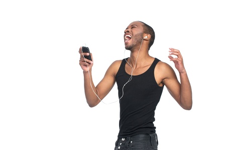a young dancer sings to music on his headphonesの写真素材