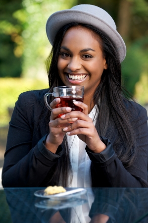 Portrait of a Beautiful African American Girl Drinking Teaの写真素材
