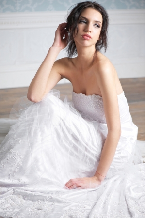 Portrait of a beautiful bride sitting の写真素材