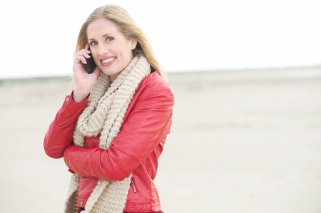 Beautiful Blond is Calling Someone on the Phoneの写真素材