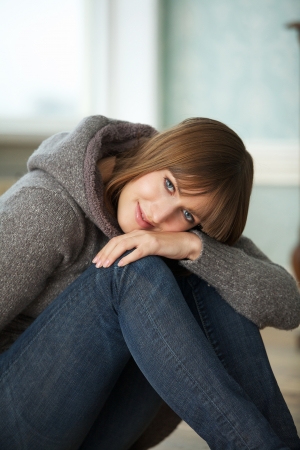 Close up portrait of a beautiful woman sittingの写真素材