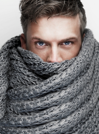 Close up portrait of scarf covering attractive faceの写真素材