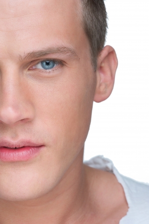 Half face close up portrait of a handseom young manの写真素材