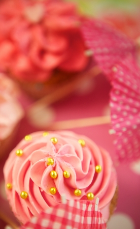 Pink cupcakes with sprinkles and frostingの写真素材