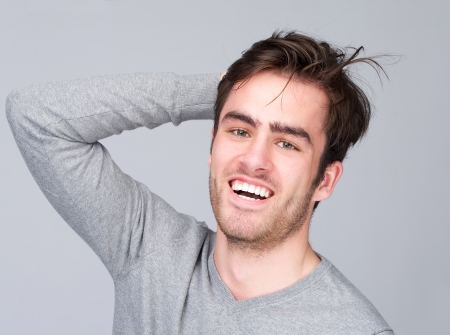 Portrait of a male fashion model with smiling expressionの写真素材