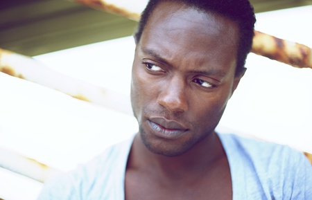 Closeup portrait of a handsome african american man looking awayの写真素材