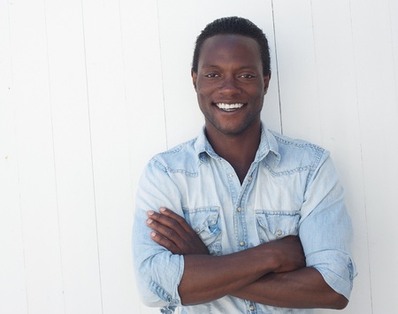 Closeup portrait of a handsome black man with arms crossed の写真素材
