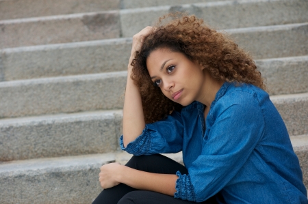 Close up portrait of a beautiful woman relaxing outdoorsの写真素材