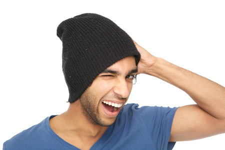 Close up portrait of a man smiling and winking with black hatの写真素材