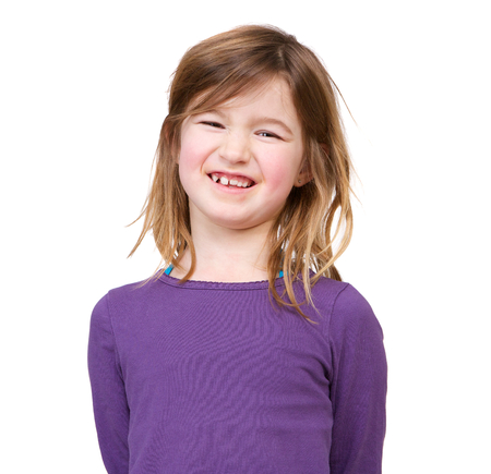 Close up portrait of a smiling young girl isolated on white background