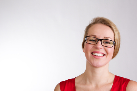Close up portrait of a happy smiling woman with glassesの写真素材