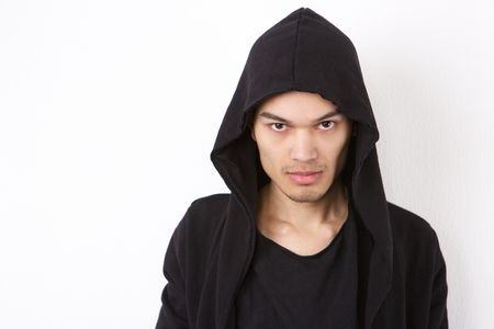 Close up portrait of  male fashion model in hood sweatshirt on isolated white background