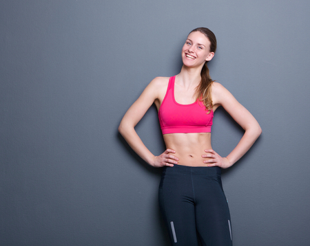 Portrait of a cheerful young woman with slim body figure の写真素材