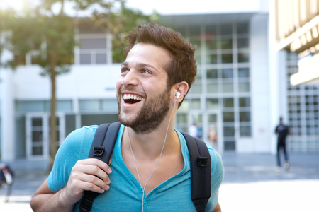 Close up portrait of a male college student walking on campus