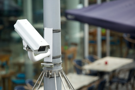 Security camera system attached to a pole outdoorsの写真素材
