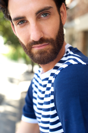 Close up portrait of a handsome young man with beardの写真素材