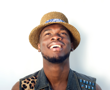 Close up portrait of a happy black man smiling and looking upの写真素材