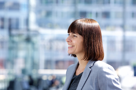 Close up side portrait of a confident smiling business womanの写真素材