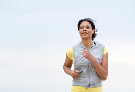Portrait of a healthy african american woman runningの写真素材