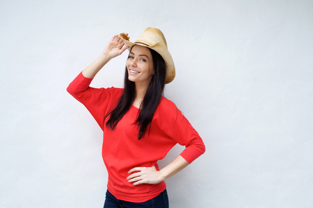 Portrait of a smiling young woman with cowboy hatの写真素材
