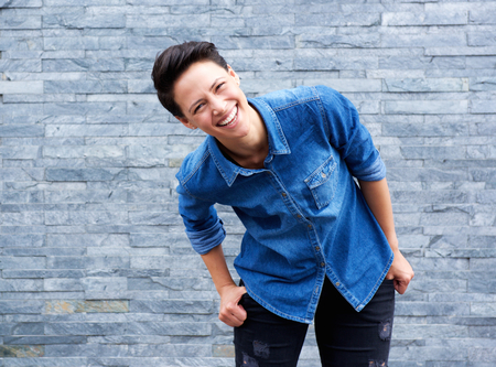 Portrait of a young woman laughingの写真素材