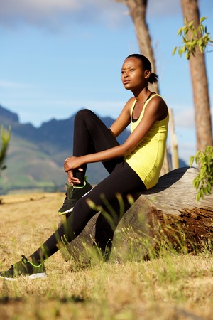 Portrait of young fitness woman relaxing after workoutの写真素材