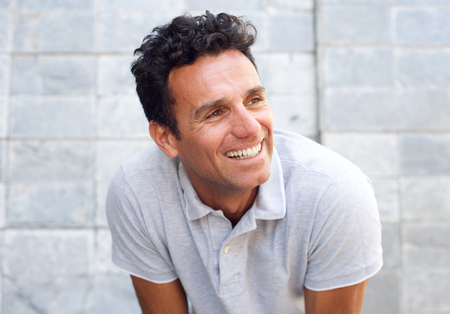 Close up portrait of a laughing older man