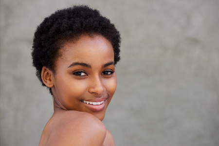 Close up beauty portrait of young african woman smilingの写真素材