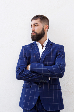 Portrait of serious attractive businessman in blue suitの写真素材