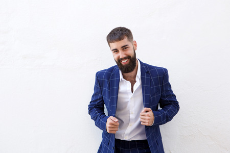 Portrait of confident businessman in blue suit posingの写真素材