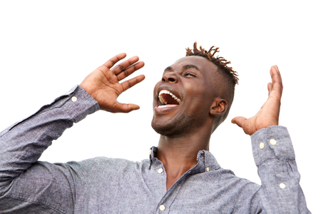 Close up portrait of excited young african man with surprised expression on white backgroundの写真素材