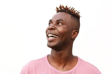 Close up portrait of young afro american man looking away and smiling against white background