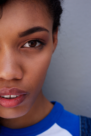 Close up half face portrait of african american womanの写真素材