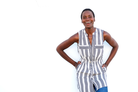 Portrait of cool young african woman posing on white background and smilingの写真素材