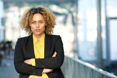 Close up portrait of businesswoman with arms crossedの写真素材