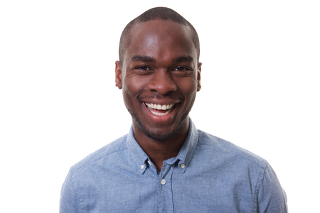 Close up portrait of happy young businessman smiling against isolated white backgroundの写真素材